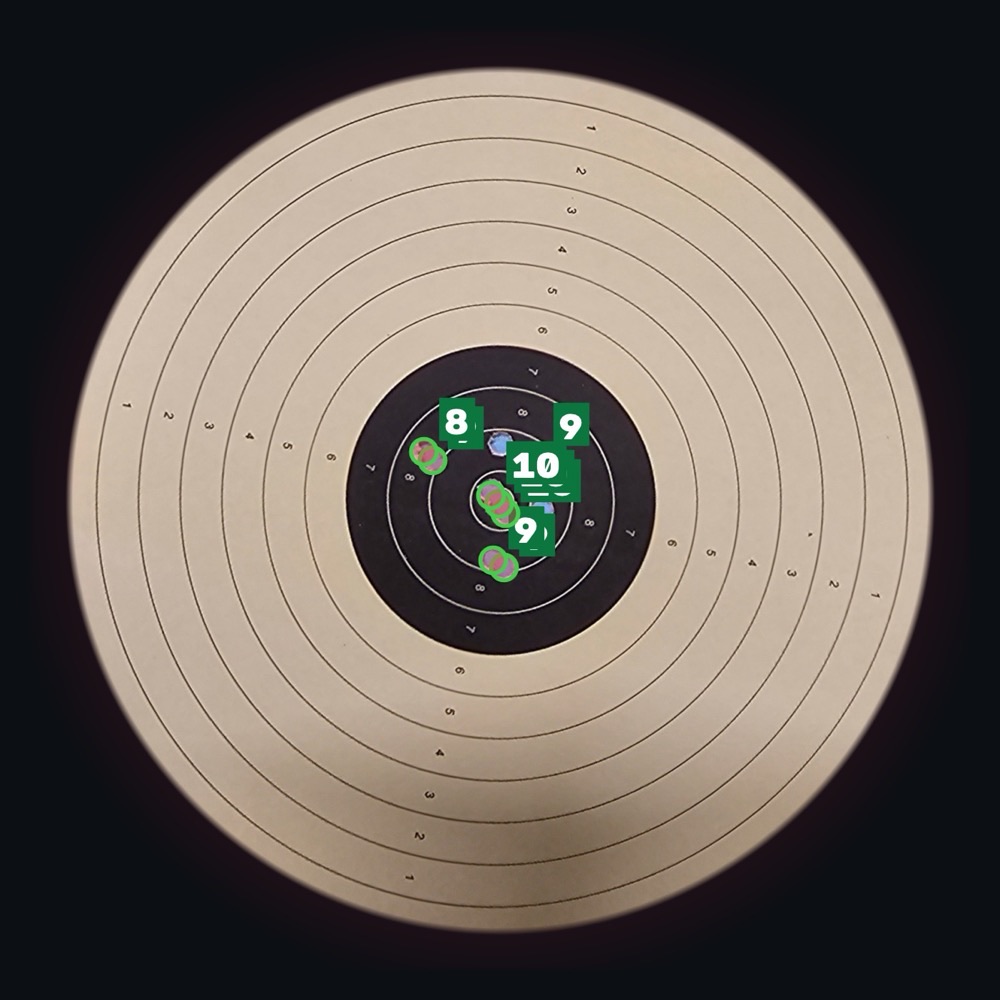 ISSF 10 m air pistol card with pellet holes